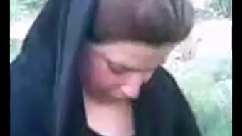 Middle Eastern Woman In Hijab Indulges In Outdoor Sex