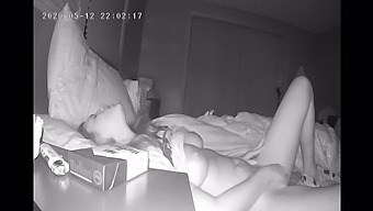 A Reserved Woman Pleasures Herself Secretly With Her Fingers Before Bedtime, Captured On Hidden Camera